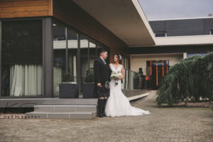 Bride and groom in front of the Carlton Hotel