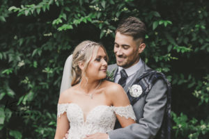 Bride and groom looking at each other