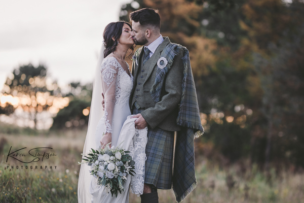 Gailes-Spa-Hotel-Irvine-Scotland (4 of 11) Bride and groom Kissing at the Gailes Hotel, groom holding brides dress