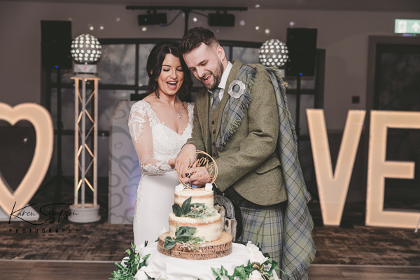 Gailes-Spa-Hotel-Irvine-Scotland (8 of 11) Bride and groom cutting the wedding cake