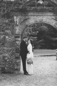 Bride and groom cuddling