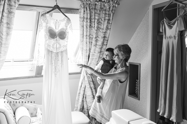 The-Gailes-Spa-Hotel-Glasgow (3 of 8) Gran holding grandchild looking at wedding dress
