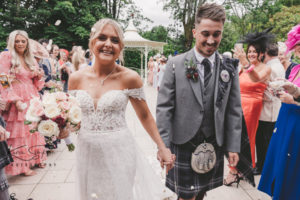 Bride and groom after confetti