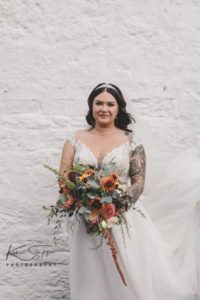 Bride on her own with her bouquet