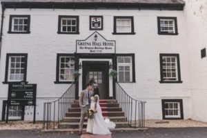 Bride and groom infront of Gretna Hall wedding