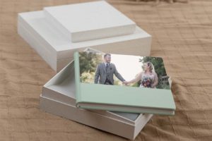 Wedding album laying on bed