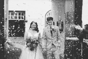 Confetti shot of the bride and groom at Gretna Hall