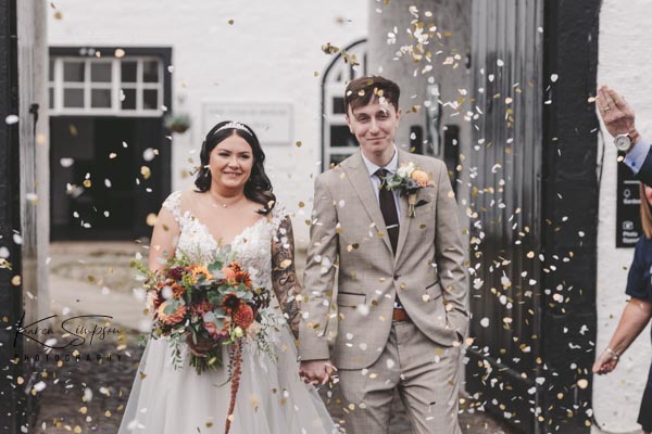 Bride and Groom Confetti shot, outside coach house gretna green