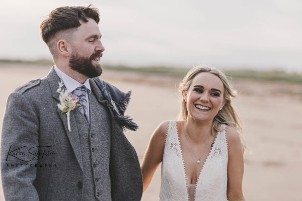 Bride and groom on beach